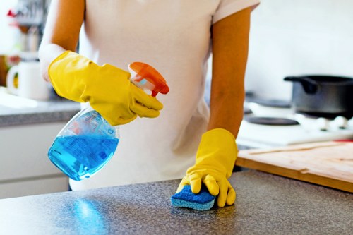 Team member following safe carpet cleaning procedures